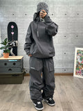 John Snow Damen-Skianzug im Cargo-Stil „Powder Pursuit Street Style“