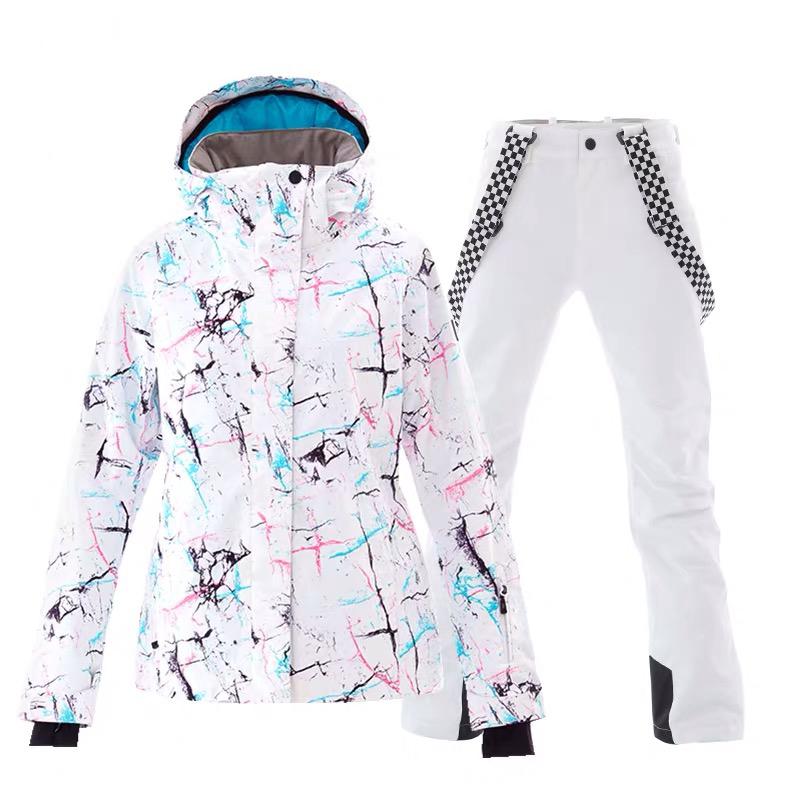 SMN Wintermode Damen-Skianzug „Metropolis“ in leuchtenden Farben – Set aus Jacke und Hose